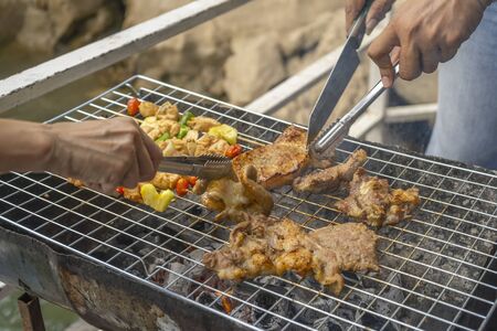 Burning meat on the grill cookout steakの写真素材