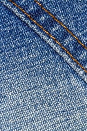 Blue jeans texture background and button and seam