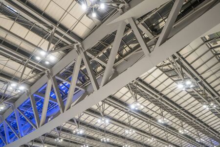 Large steel frame in the building with spotlights.の写真素材