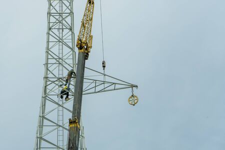 Use crane to lift the light bulbs to repair the light poleの写真素材