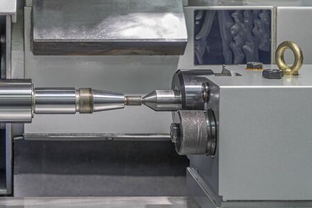 Screw lathe machine, lathe threading machine, turning machine cutting screw threads on a lathe tool processing in a workshop.の写真素材