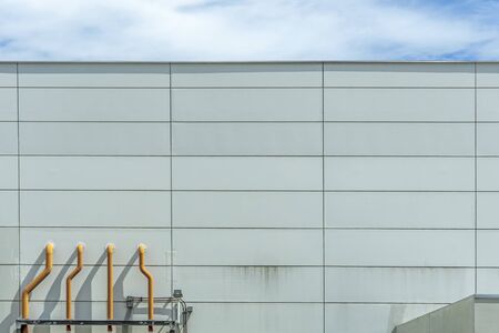 Several ventilation vents are located next to the building.の写真素材