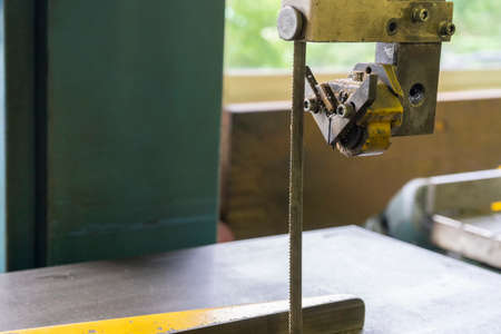 Old jig Saw table holding manual jig saw machineの写真素材