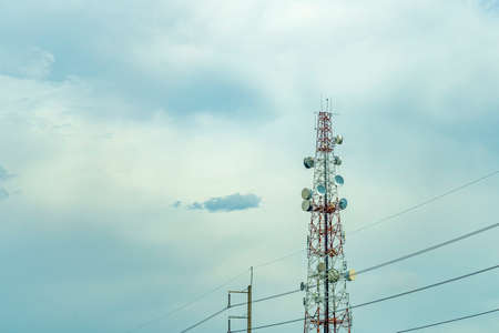 Transmission towers and electric poles with the overcast skyの写真素材
