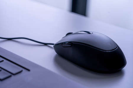 Computer mouse optic on table in work officeの写真素材