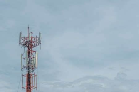 Mobile phone communication tower transmission  signal with blue sky background and antennaの写真素材