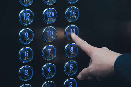 Push the elevator button 11thの写真素材