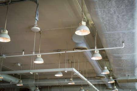 Air duct conditioning ceiling in the building and lampの写真素材