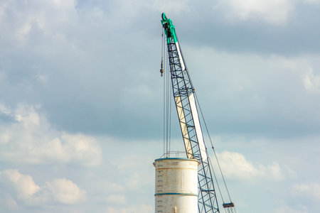 Large white water tank with blue sky.の写真素材
