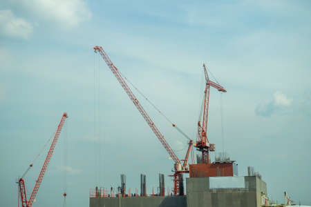 building site with cranes and blue sky
