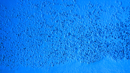 Dark blue cement wall, raw cement surface wall textured 16:9 backgroundの写真素材