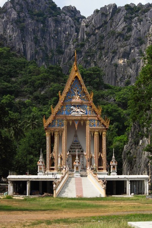 Temple in Thailand behind the mountainの写真素材