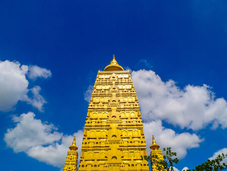 Golden stupa on clear skyの写真素材