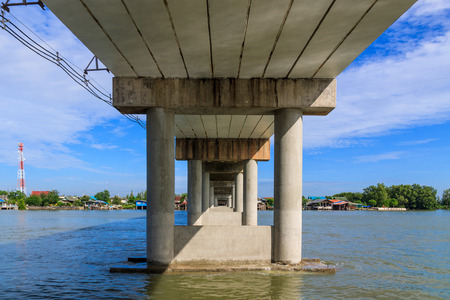 Cement pillars of the bridge across the riverの写真素材