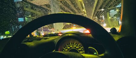 Driving in the city of rain
