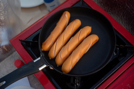 Grilled sausages in a grill panの写真素材