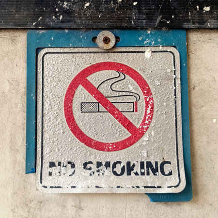 The old no smoking sign was discardedの写真素材
