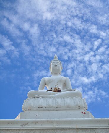 White Buddha statue and blue skyの写真素材
