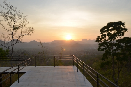 back tree and mountain landscape at Sunsetの写真素材