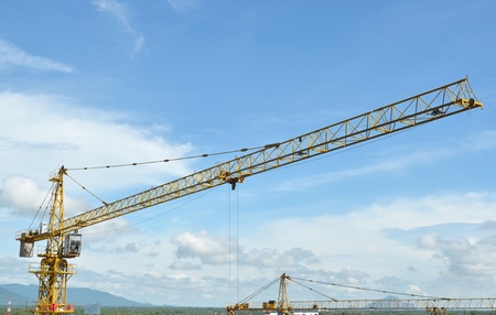 Crane and building working progress, construction site