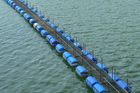 Buoy floating on water in Hydroelectric Power plant of damの写真素材