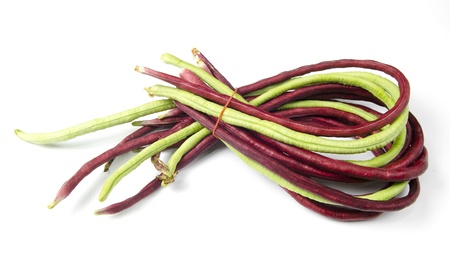 bundle of fresh long beans(Vigna unguiculata subsp. sesquipedalis) on a white backgroundの写真素材