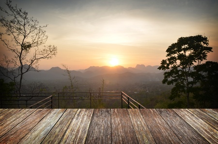Beautiful sunlight in the autumn forest with wood planks floor