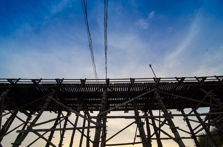 Wood bridge with river and mountain in Kanchanaburi Thailandの写真素材