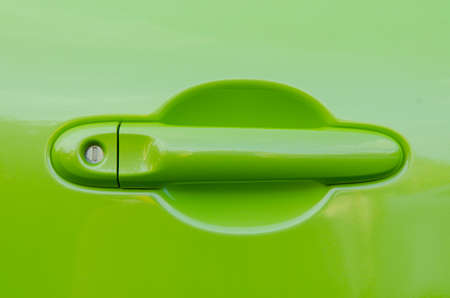 green handle on the door of the carの写真素材
