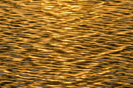 Water surface with brightness in the distanceの写真素材
