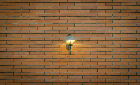 red brick wall texture grunge background with vignetted corners of interiorの写真素材