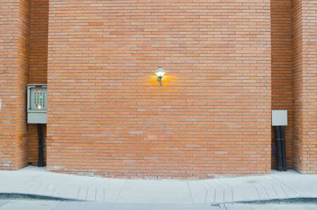 red brick wall texture grunge background with vignetted corners of interiorの写真素材