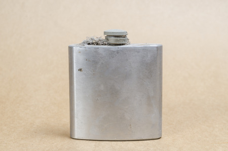 old flat steel bottles on vintage paper backgroundの写真素材