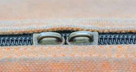 Closeup of zipper on old fabric textureの写真素材