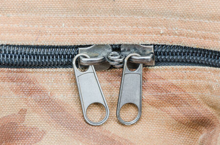 Closeup of zipper on old fabric textureの写真素材