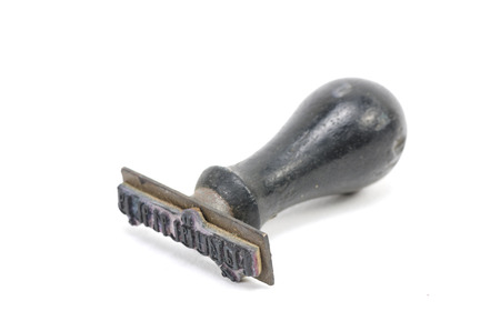 old rubber stamp isolated on white backgroundの写真素材