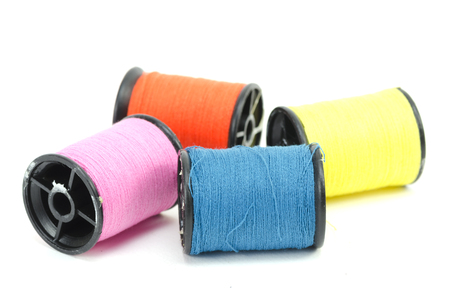 colorful sewing Threads isolated on white background