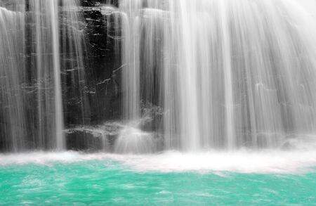 part of a waterfall taken with a slow shutter speed to smooth the waterの写真素材