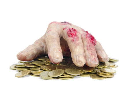 money concept with human skull and handの写真素材