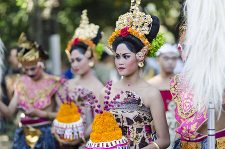 DENPASAR, BALI, INDONESIA - JUNE 18: Unidentified dancer of Balinese in colorful dresses variety on the parade at Bali Art Festival on June 18, 2014 in Denpasar, Indonesiaのeditorial素材