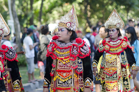 DENPASAR, BALI, INDONESIA - JUNE 18: Unidentified dancer of Balinese in colorful dresses variety on the parade at Bali Art Festival on June 18, 2014 in Denpasar, Indonesiaのeditorial素材