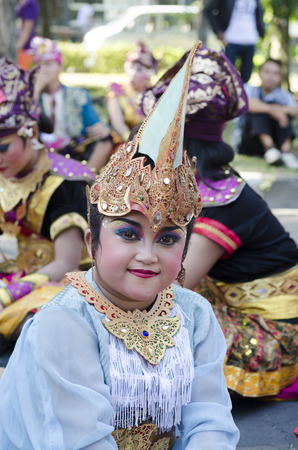DENPASAR, BALI, INDONESIA - JUNE 18: Unidentified dancer of Balinese in colorful dresses variety on the parade at Bali Art Festival on June 18, 2014 in Denpasar, Indonesiaのeditorial素材
