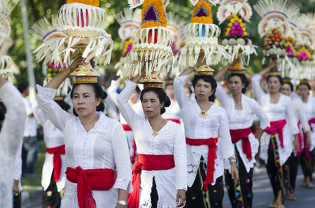 DENPASAR, BALI, INDONESIA - JUNE 18: Unidentified dancer of Balinese in colorful dresses variety on the parade at Bali Art Festival on June 18, 2014 in Denpasar, Indonesiaのeditorial素材
