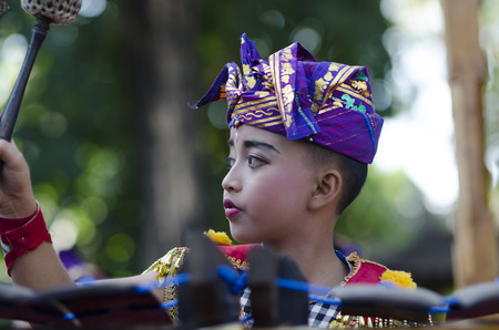 DENPASAR, BALI, INDONESIA - JUNE 18: Unidentified dancer of Balinese in colorful dresses variety on the parade at Bali Art Festival on June 18, 2014 in Denpasar, Indonesiaのeditorial素材