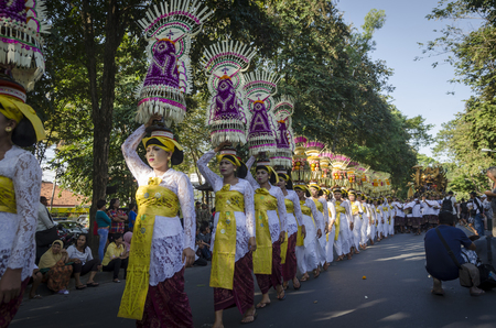 DENPASAR, BALI, INDONESIA - JUNE 18: Unidentified dancer of Balinese in colorful dresses variety on the parade at Bali Art Festival on June 18, 2014 in Denpasar, Indonesiaのeditorial素材