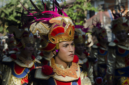 DENPASAR, BALI, INDONESIA - JUNE 18: Unidentified dancer of Balinese in colorful dresses variety on the parade at Bali Art Festival on June 18, 2014 in Denpasar, Indonesiaのeditorial素材
