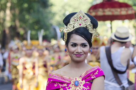 DENPASAR, BALI, INDONESIA - JUNE 18: Unidentified dancer of Balinese in colorful dresses variety on the parade at Bali Art Festival on June 18, 2014 in Denpasar, Indonesiaのeditorial素材