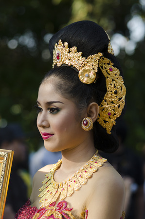 DENPASAR, BALI, INDONESIA - JUNE 18: Unidentified dancer of Balinese in colorful dresses variety on the parade at Bali Art Festival on June 18, 2014 in Denpasar, Indonesiaのeditorial素材