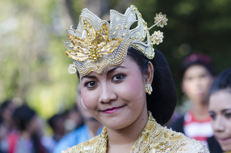 DENPASAR, BALI, INDONESIA - JUNE 18: Unidentified dancer of Balinese in colorful dresses variety on the parade at Bali Art Festival on June 18, 2014 in Denpasar, Indonesiaのeditorial素材
