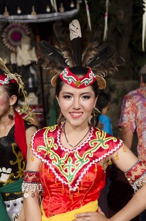 DENPASAR, BALI, INDONESIA - JUNE 14: Unidentified dancer from the indigenous Borneo people performs a traditional Borneo dance at Bali Art Festival on June 14, 2014 in Denpasar, Indonesiaのeditorial素材